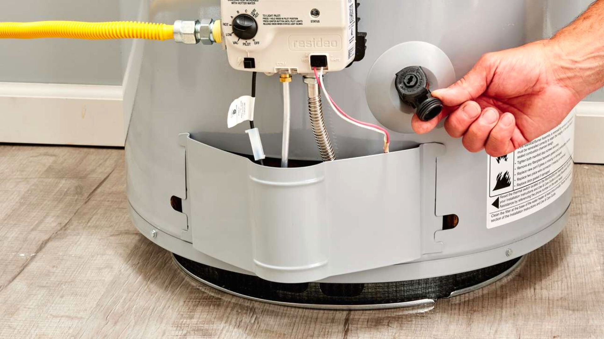 2023 03 Man Fixing Water Heater Man Fixing Water Heater