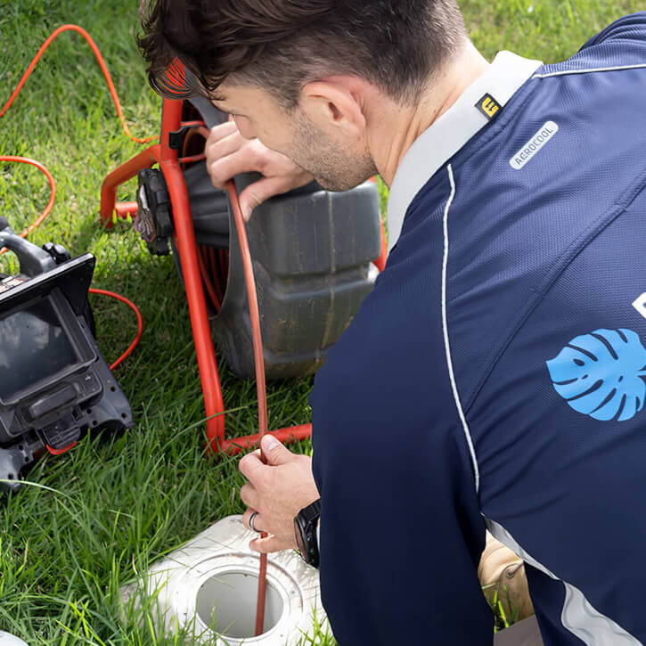 Plumber Inspecting Drain